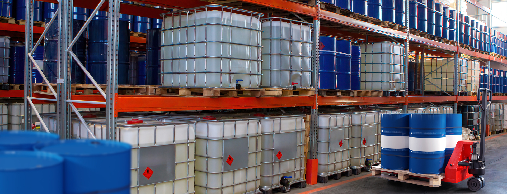 Industrial barrels stored on warehouse shelves
