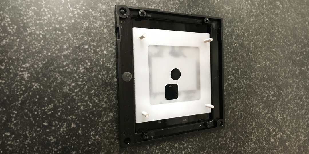 Wall-mounted housing for access readers